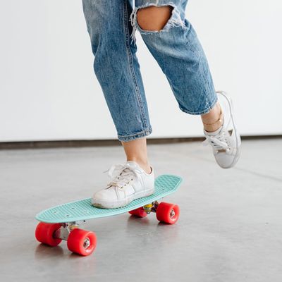 Close-up of comfortable athletic shoes on a dark floor.